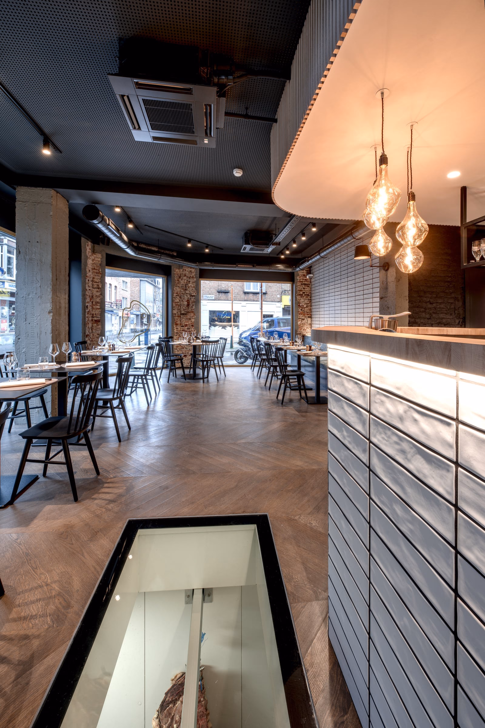 The dining room of a restaurant, with tables and chairs