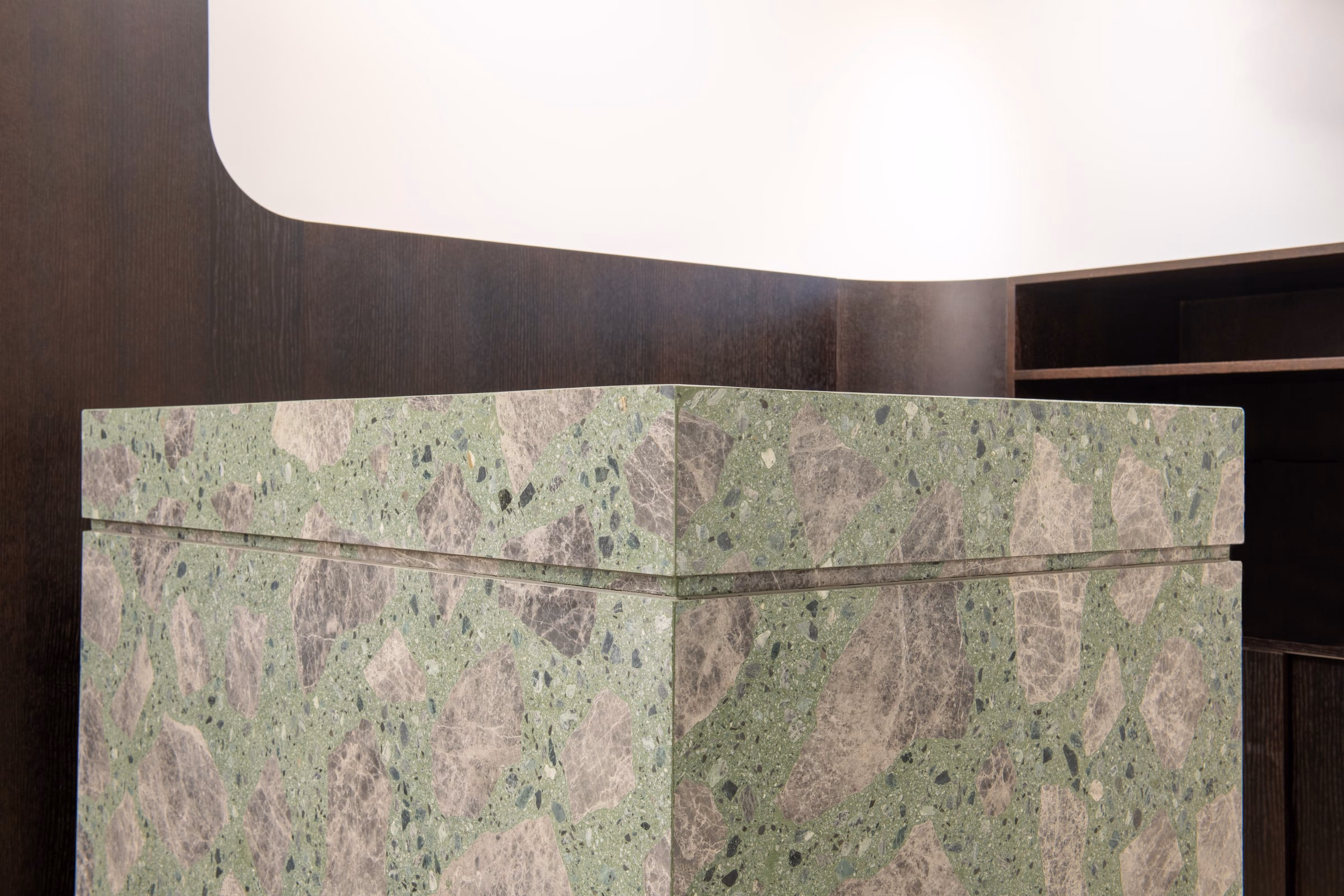 A counter with a green and grey marble top