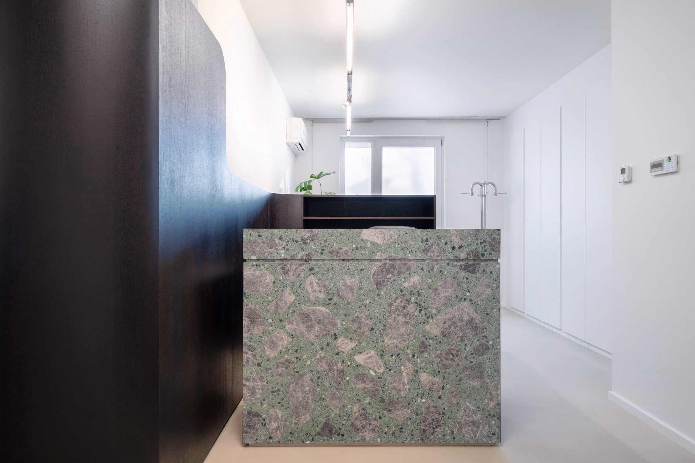 A green and grey counter in a room