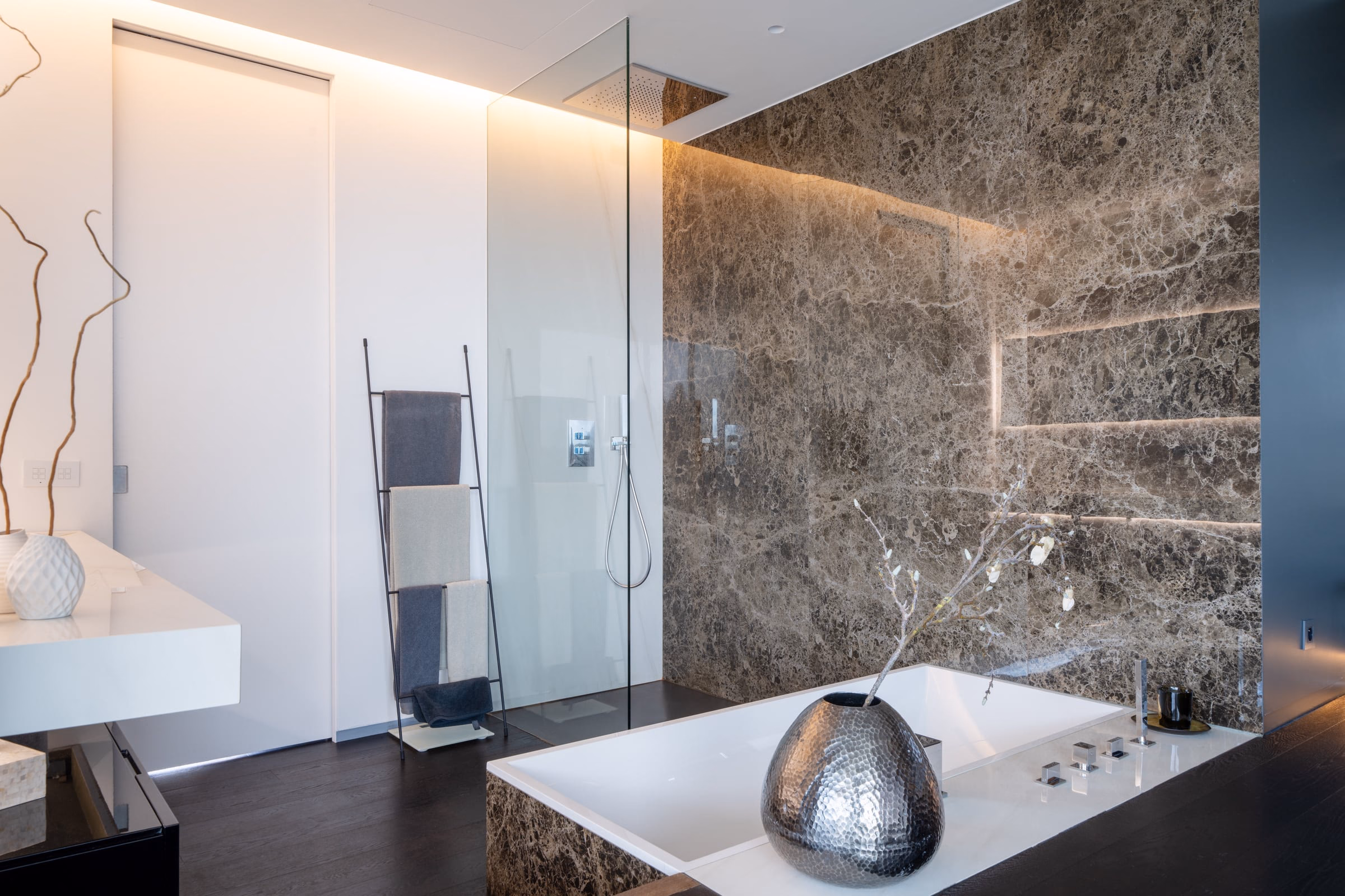 A bathroom with a walk-in shower and a bathtub