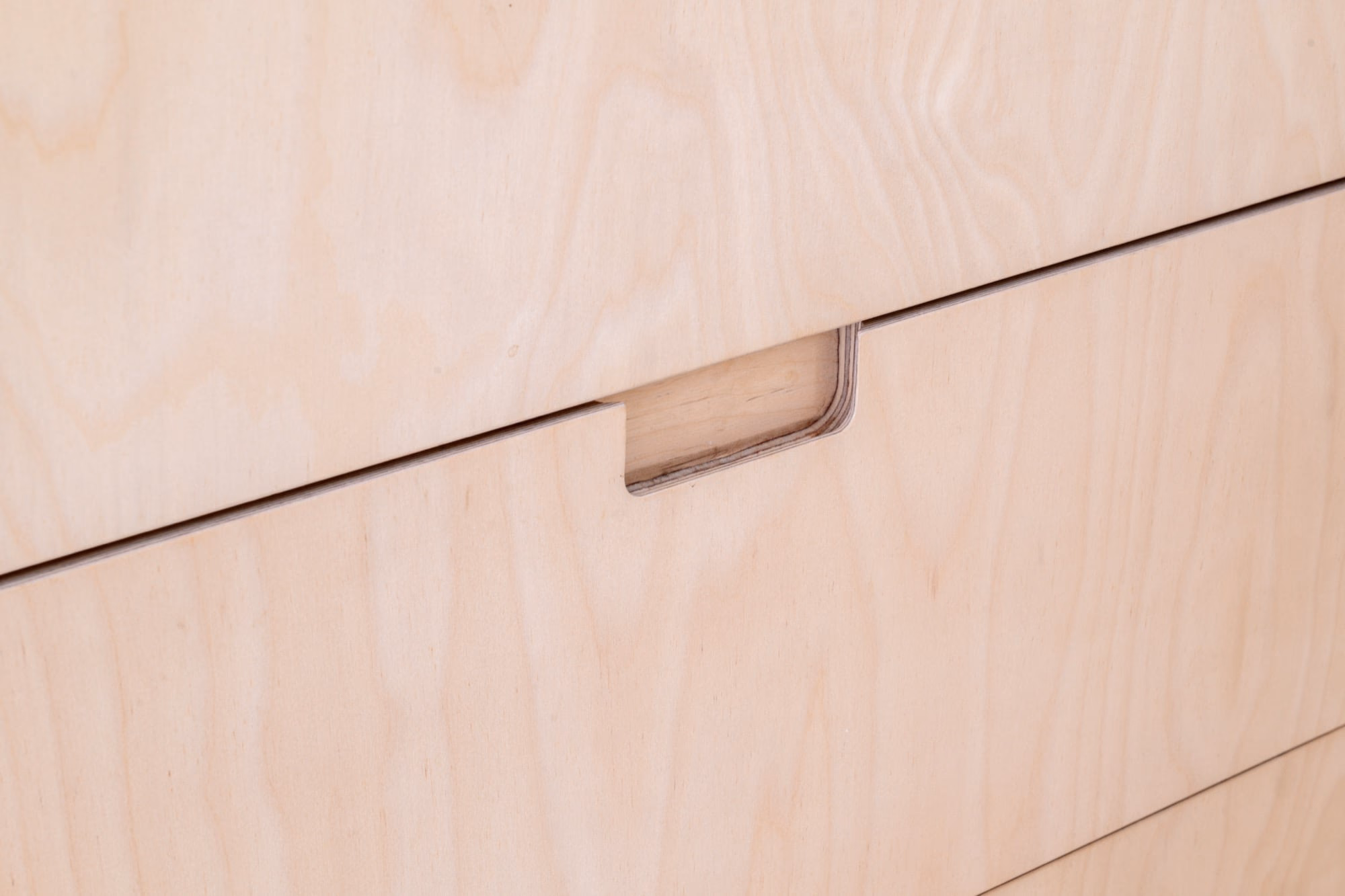 Detail of a wooden drawer and its handle