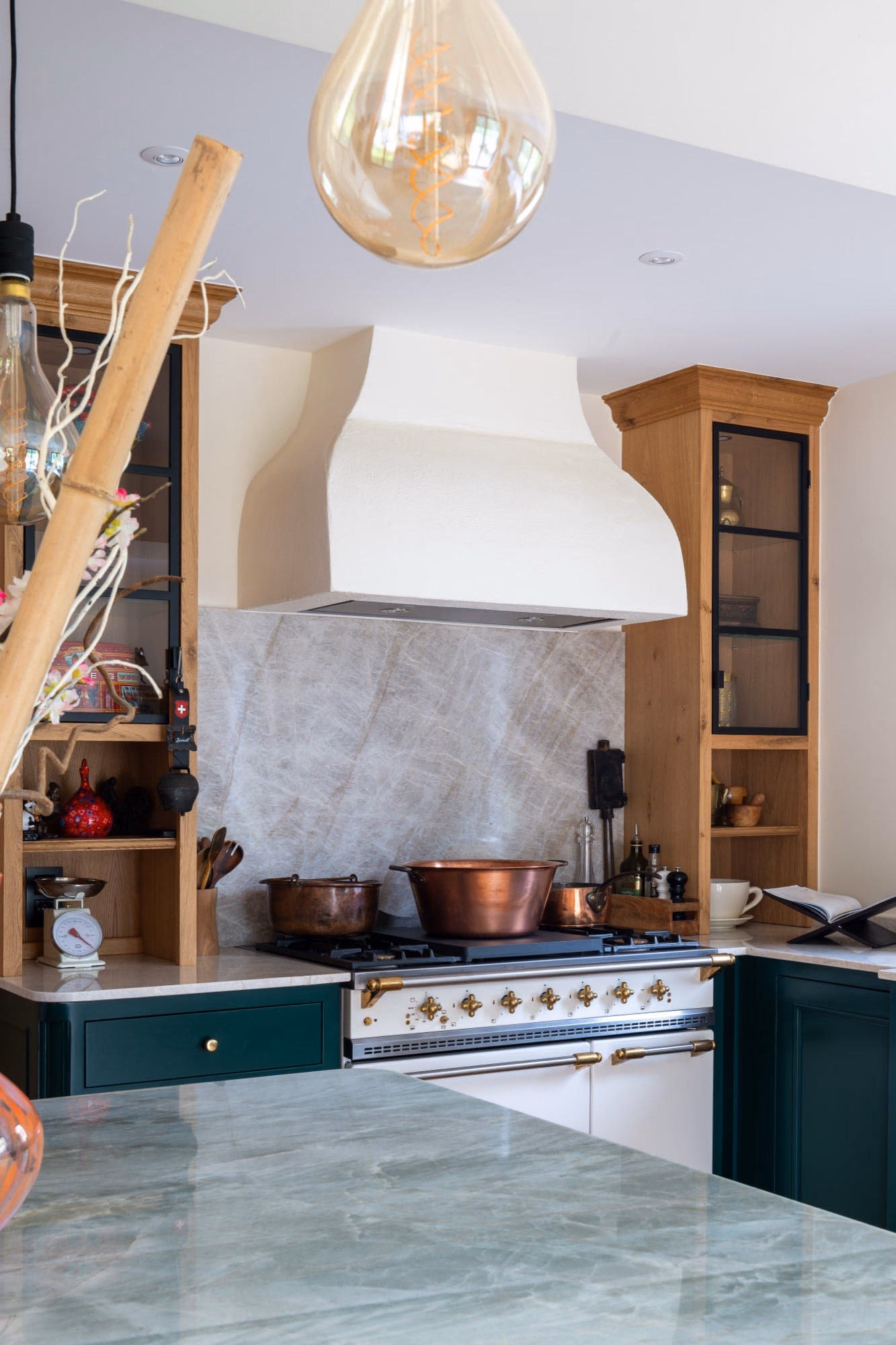 A copper pan on the hob in a kitchen