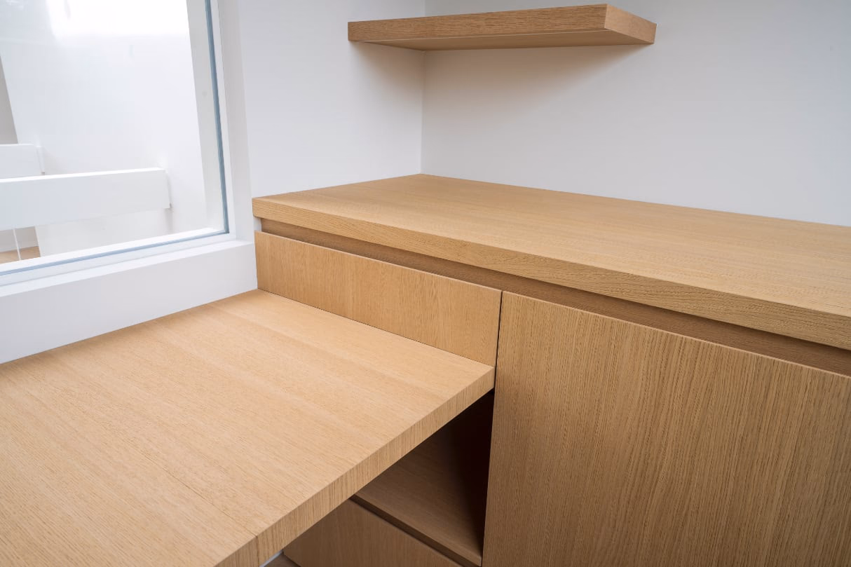 A wooden desk with a drawer