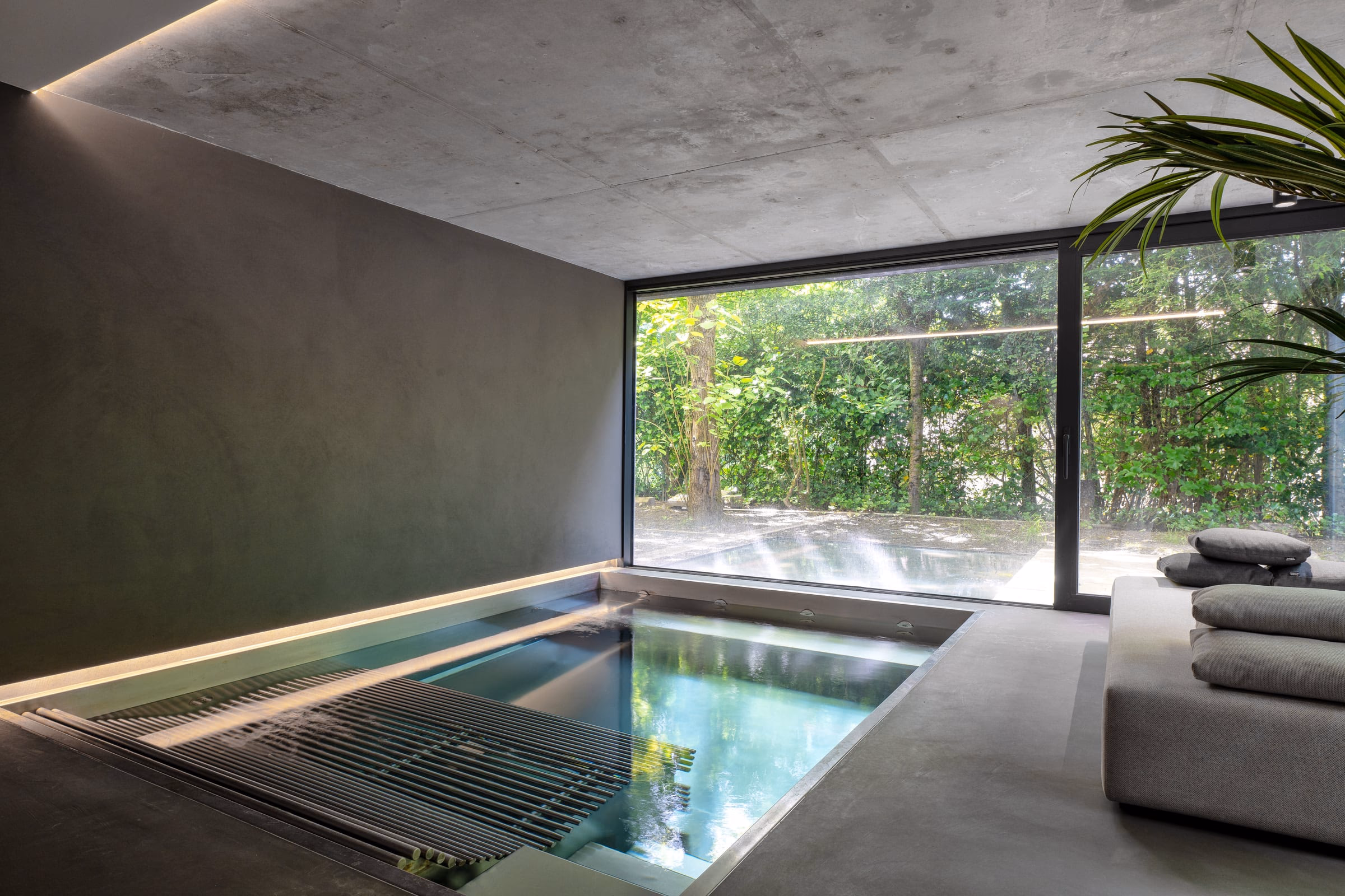An indoor swimming pool with a large window