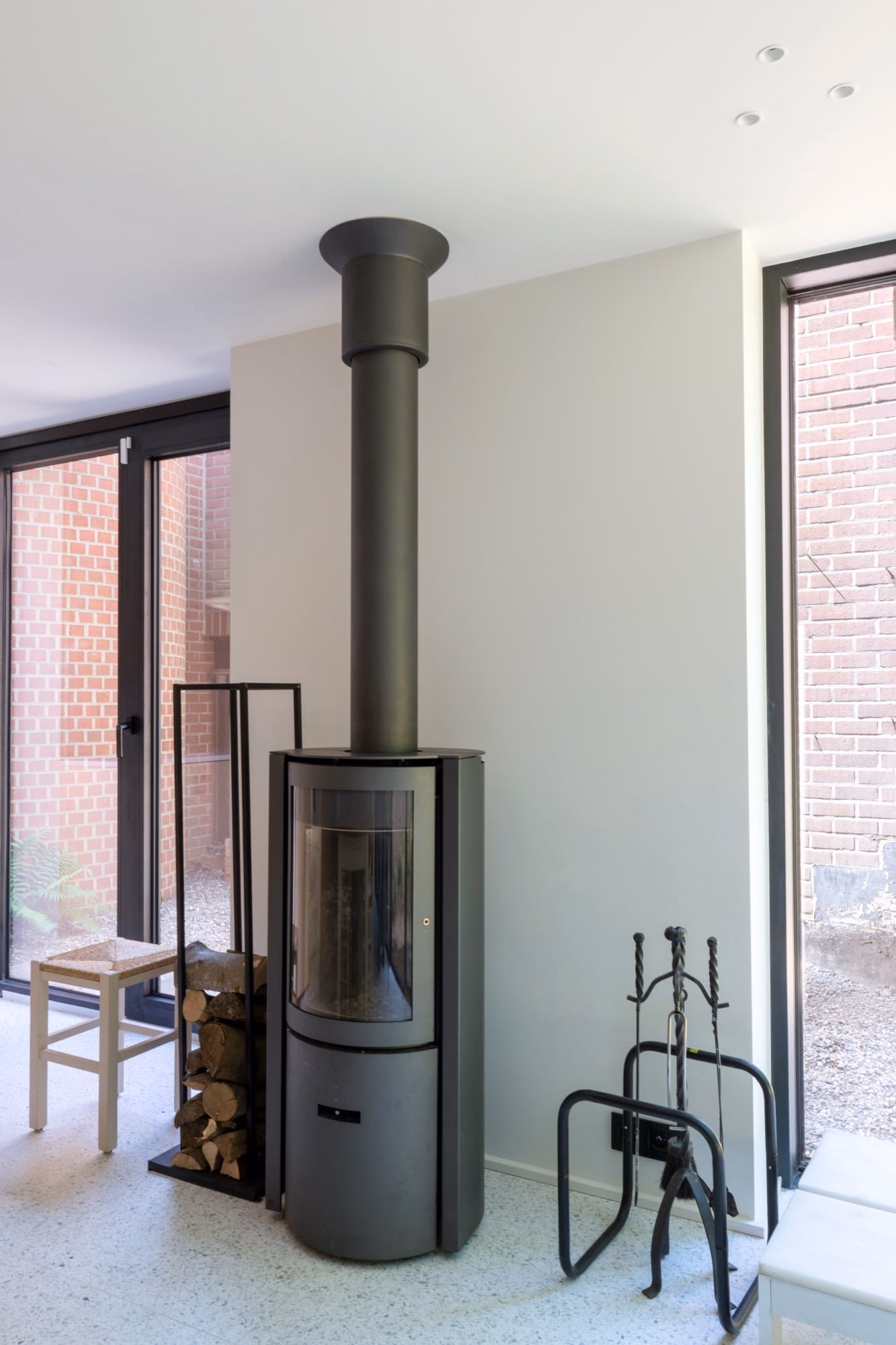 A fireplace against a brick wall