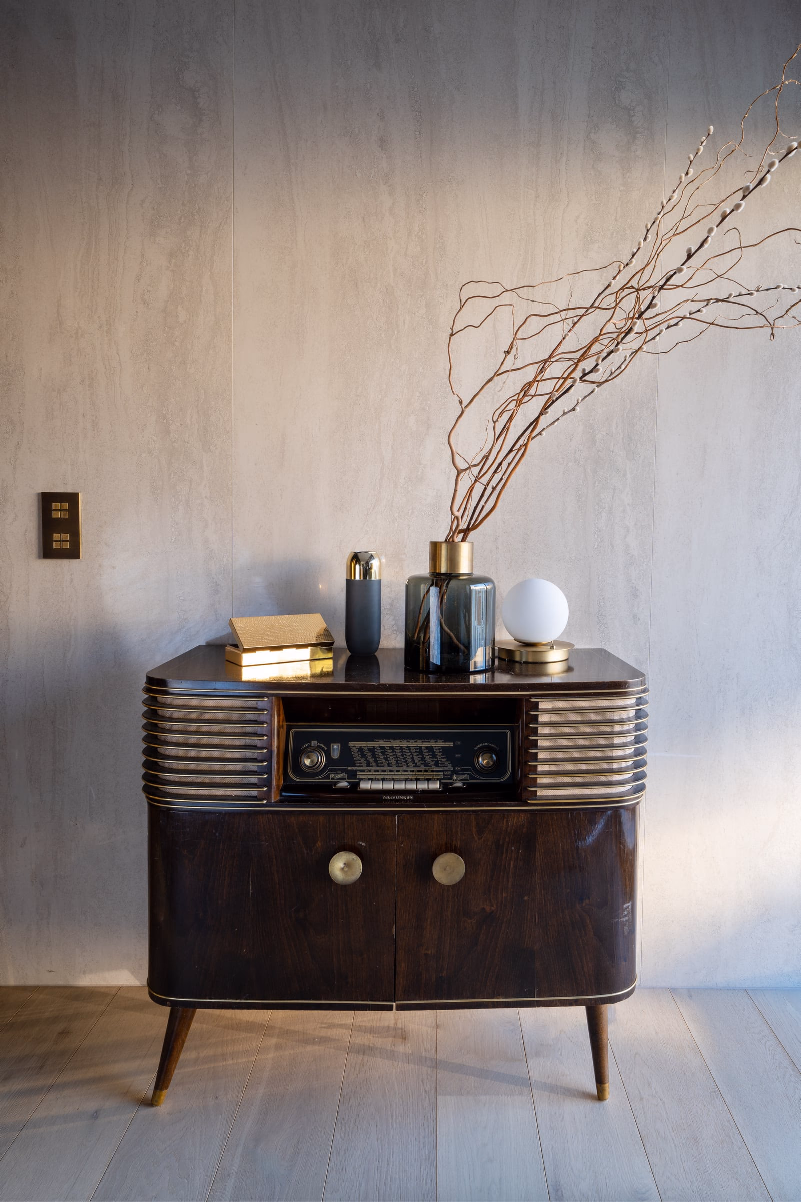 A vintage radio on a wooden cabinet