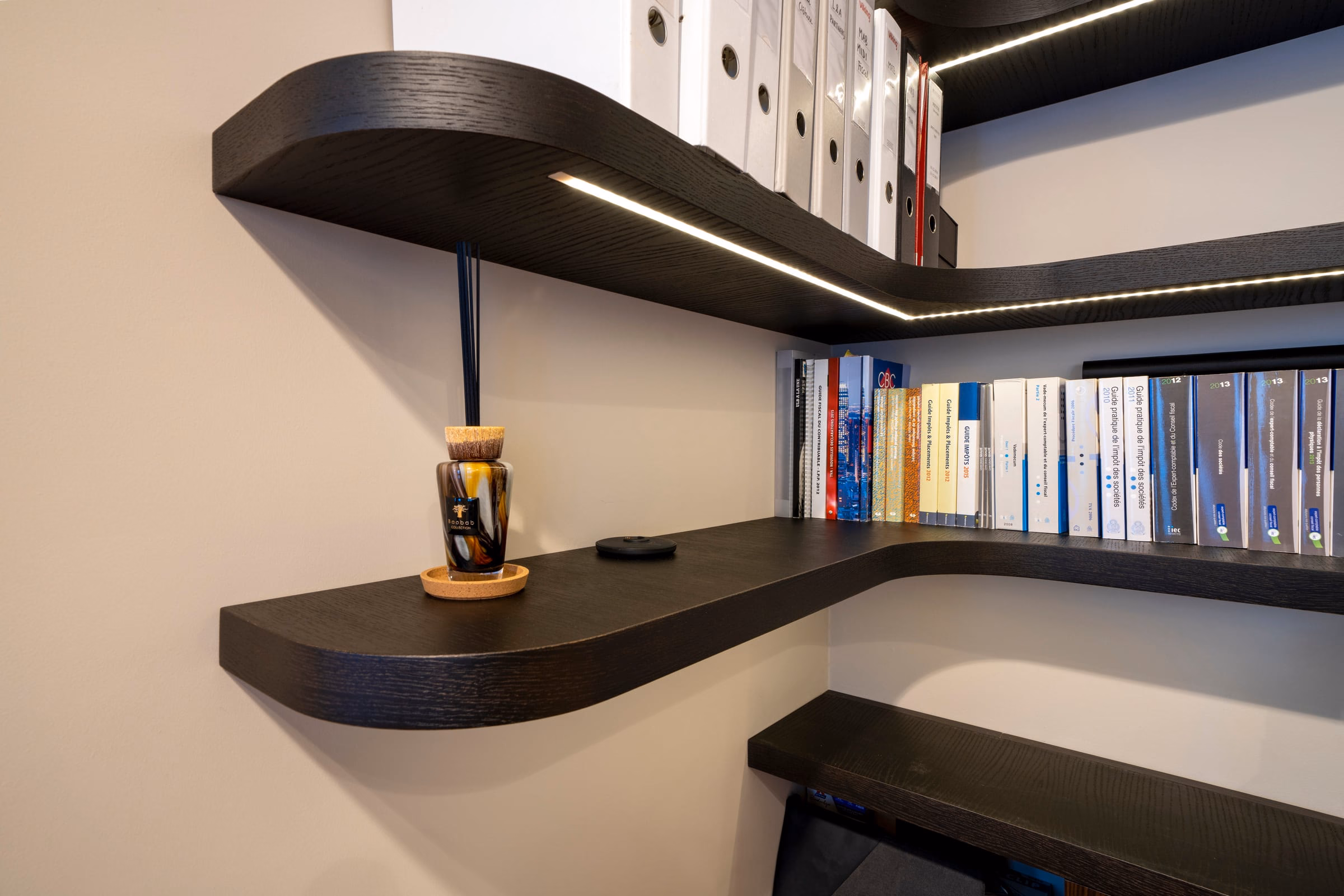 A shelf with a few books