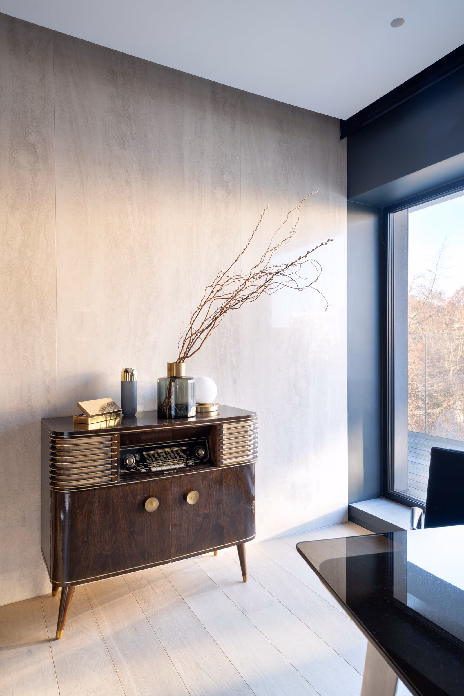 A wooden cabinet with a radio on top