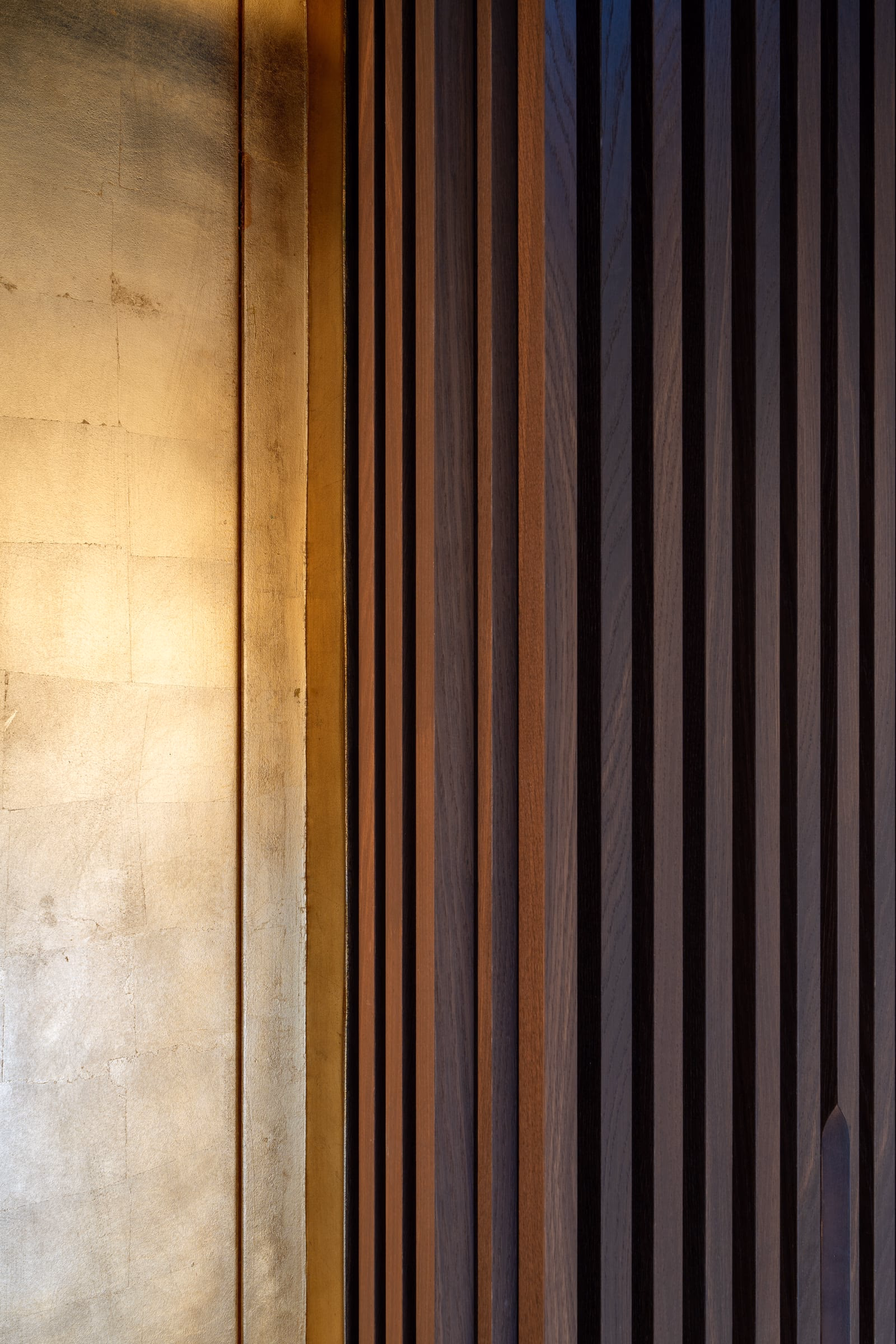 Detail of a wooden wall with black stripes