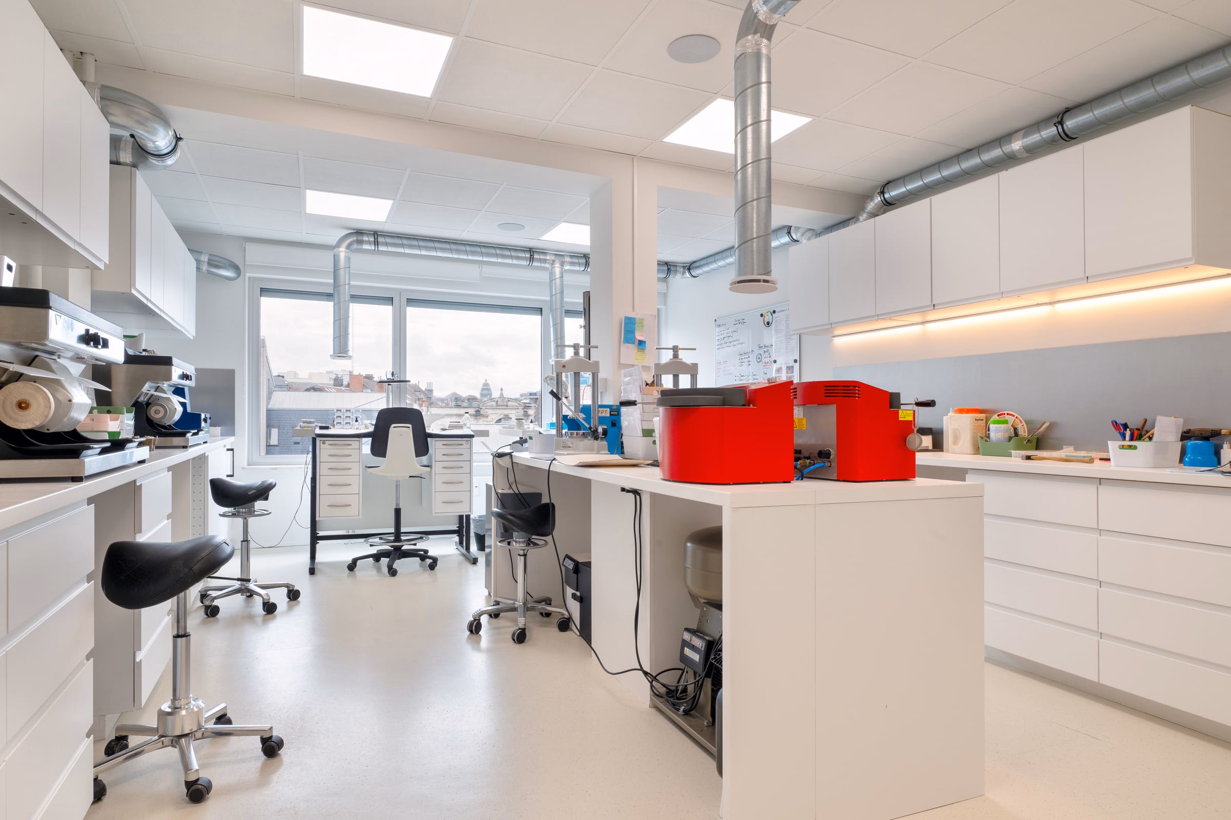 A red machine on a laboratory counter