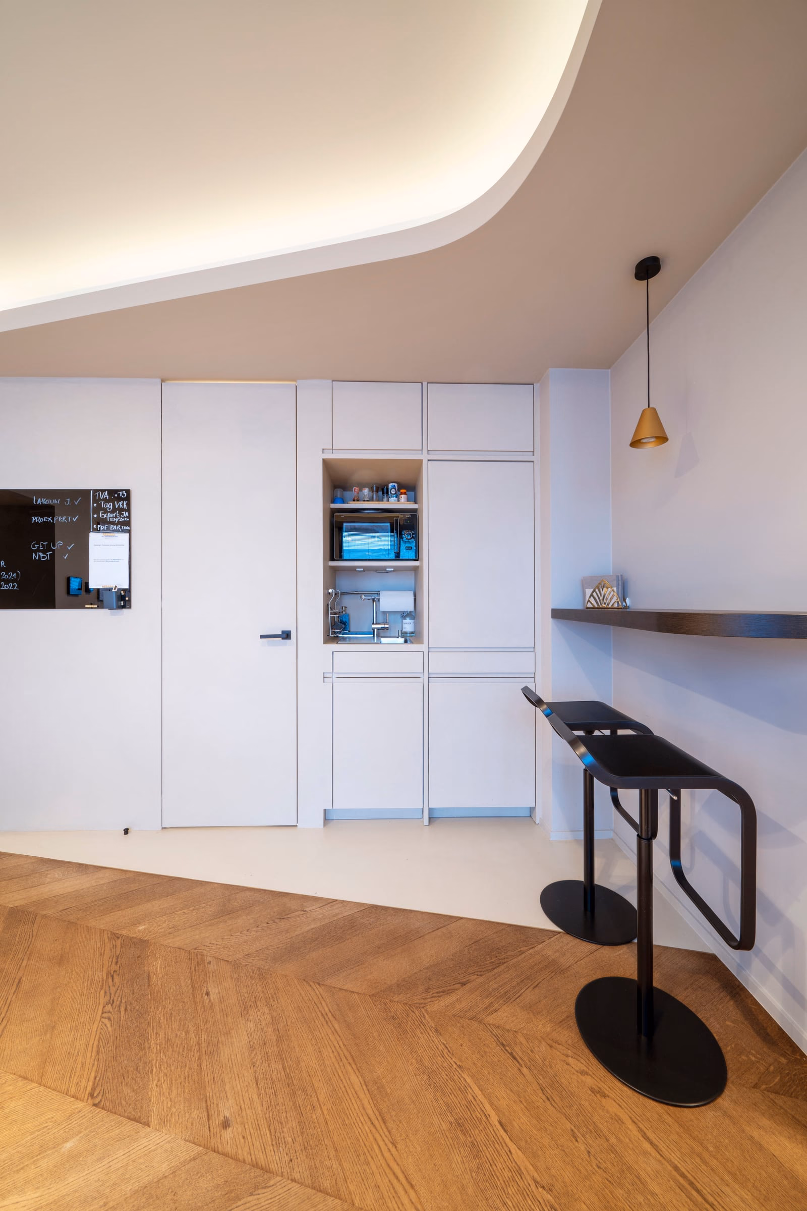 A small kitchen with a microwave and a sink