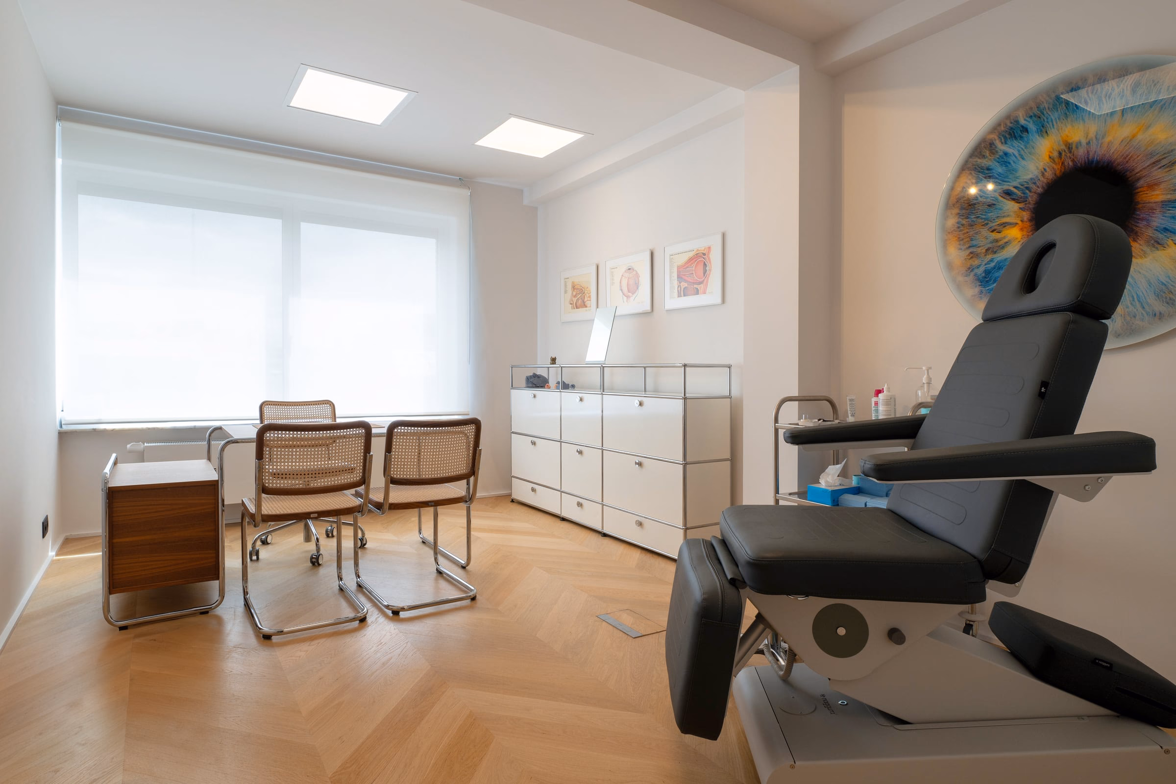 A consultation room with a chair and a desk