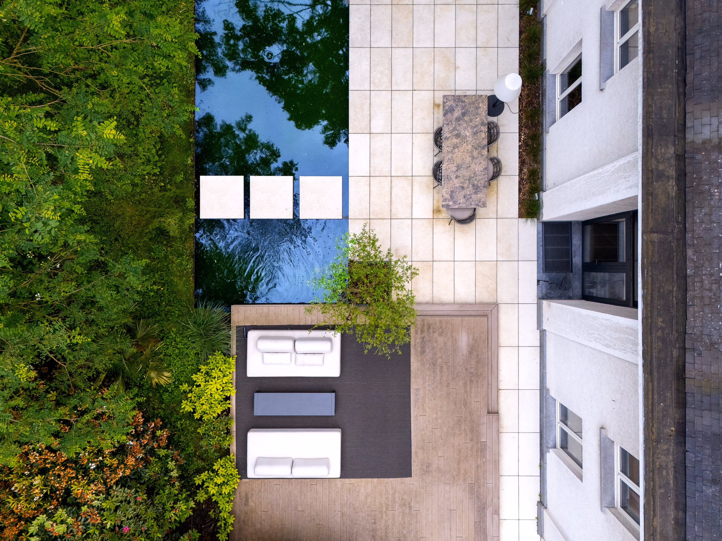 An aerial view of a terrace with a table and chairs