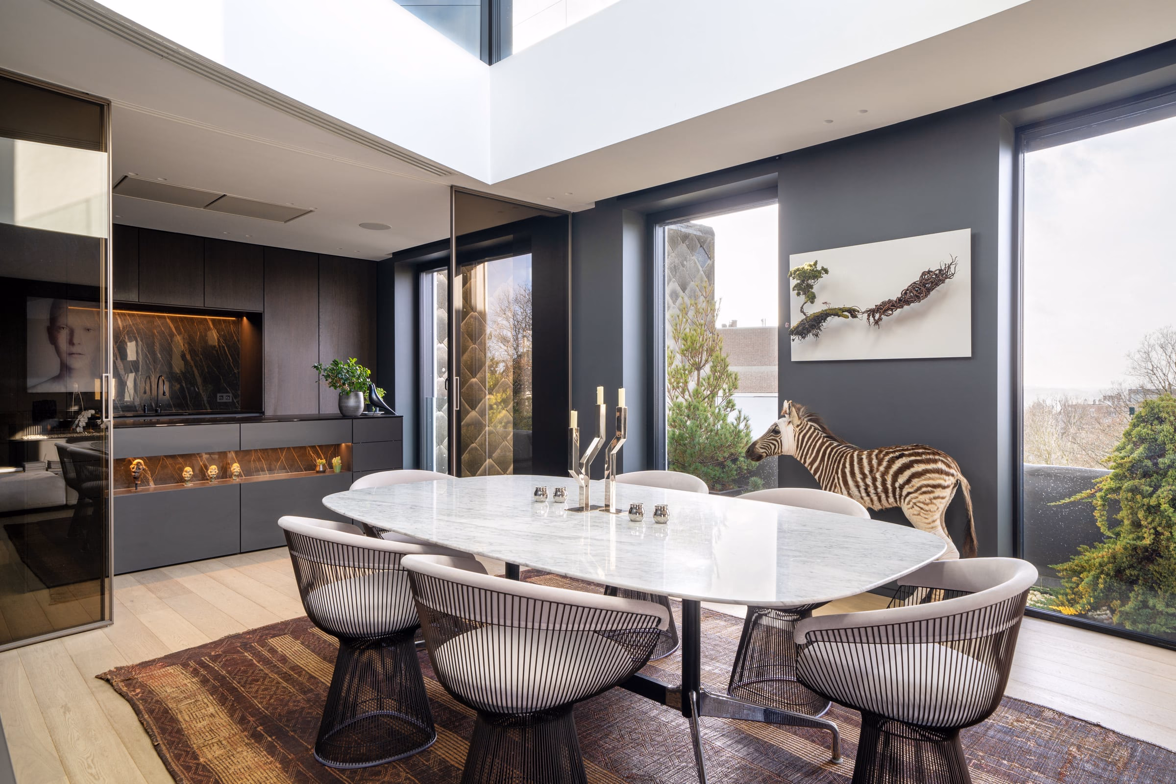 A dining room with a zebra sculpture