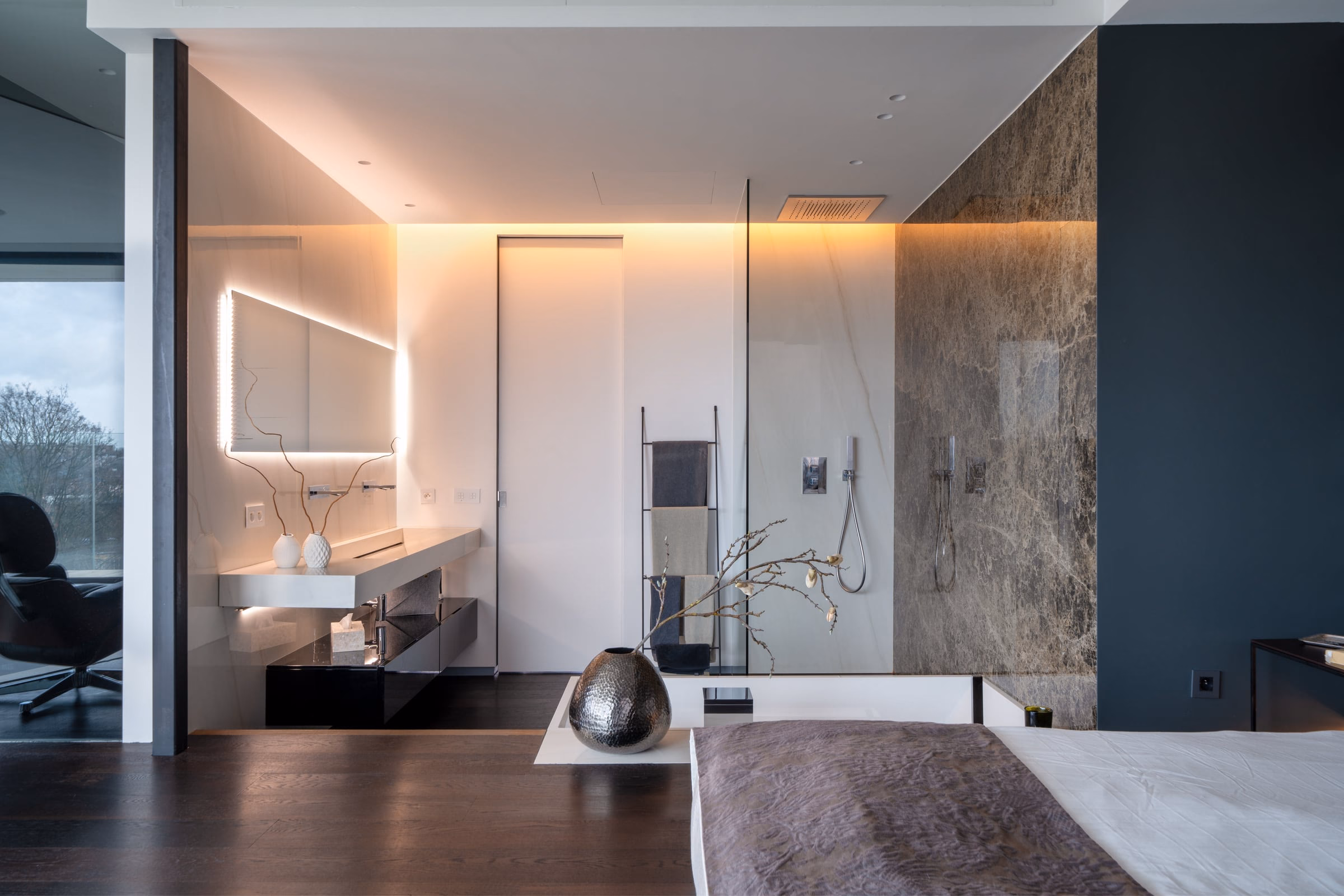A bathroom with two washbasins and a walk-in shower