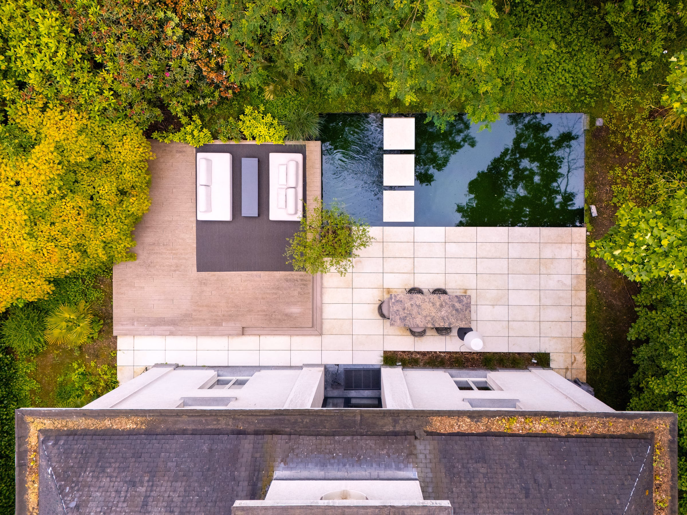 An aerial view of a terrace with a table and chairs