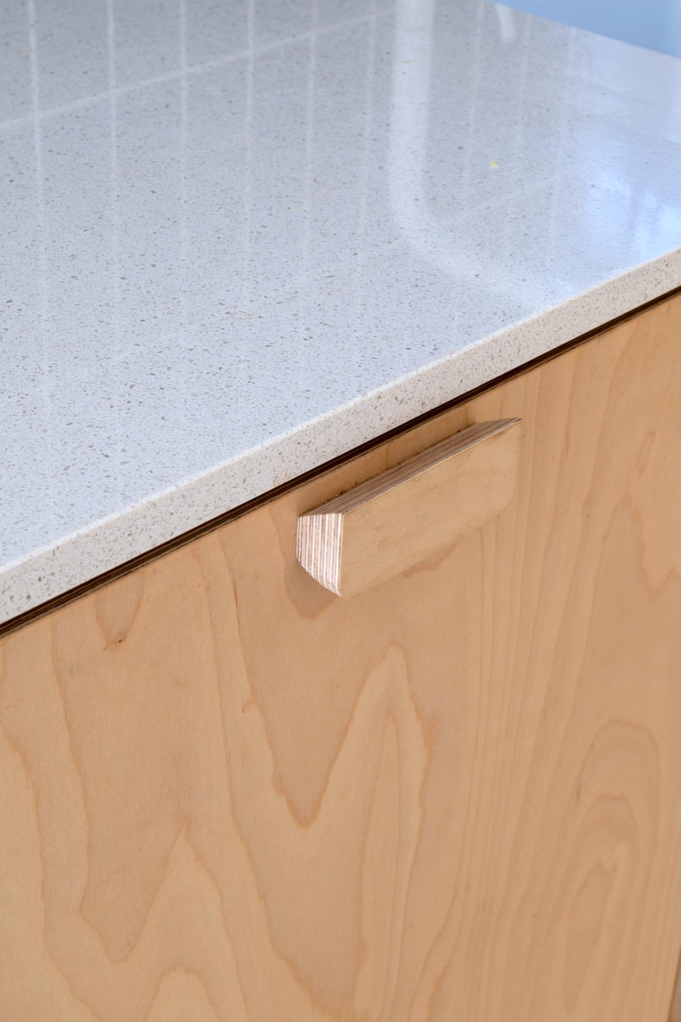 A wooden cabinet with a white worktop