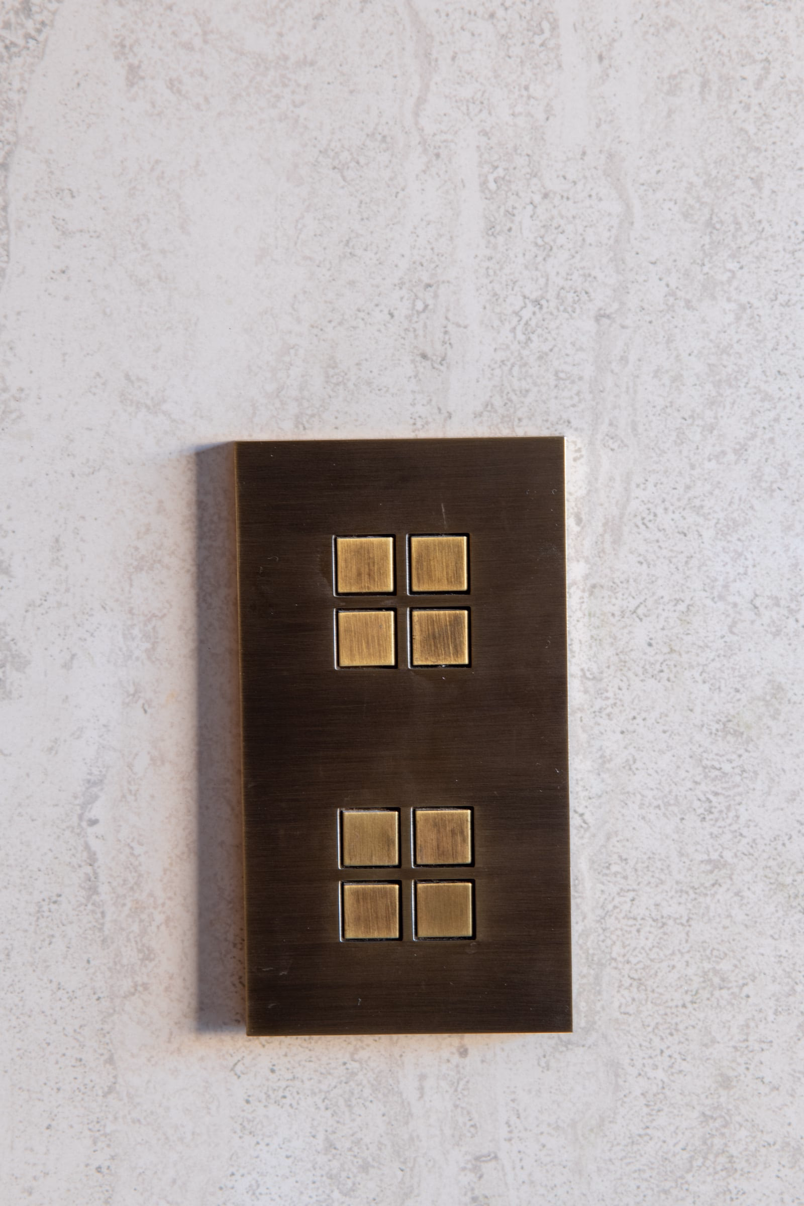 A light switch with four square buttons