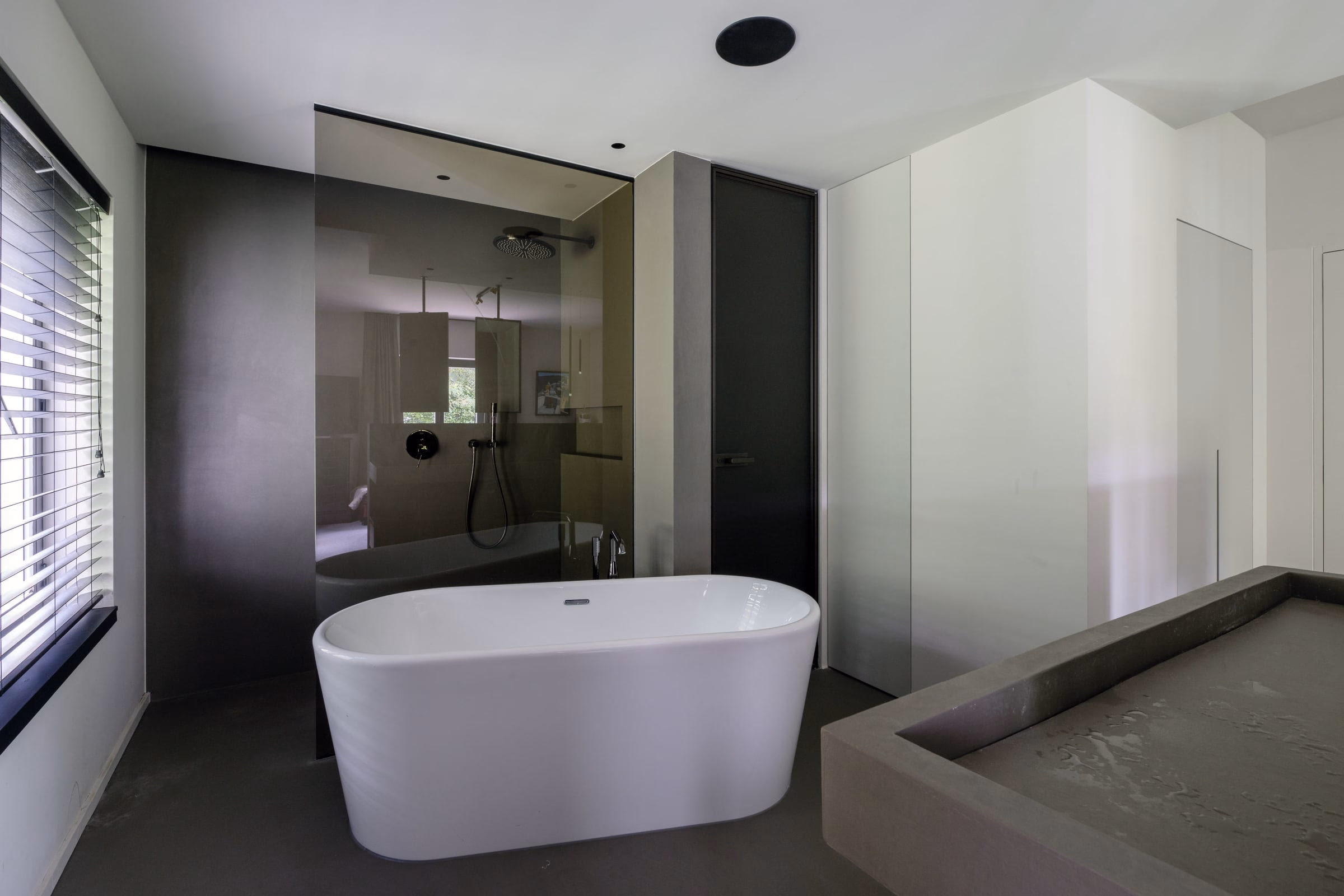 A bathroom with a bathtub and a shower