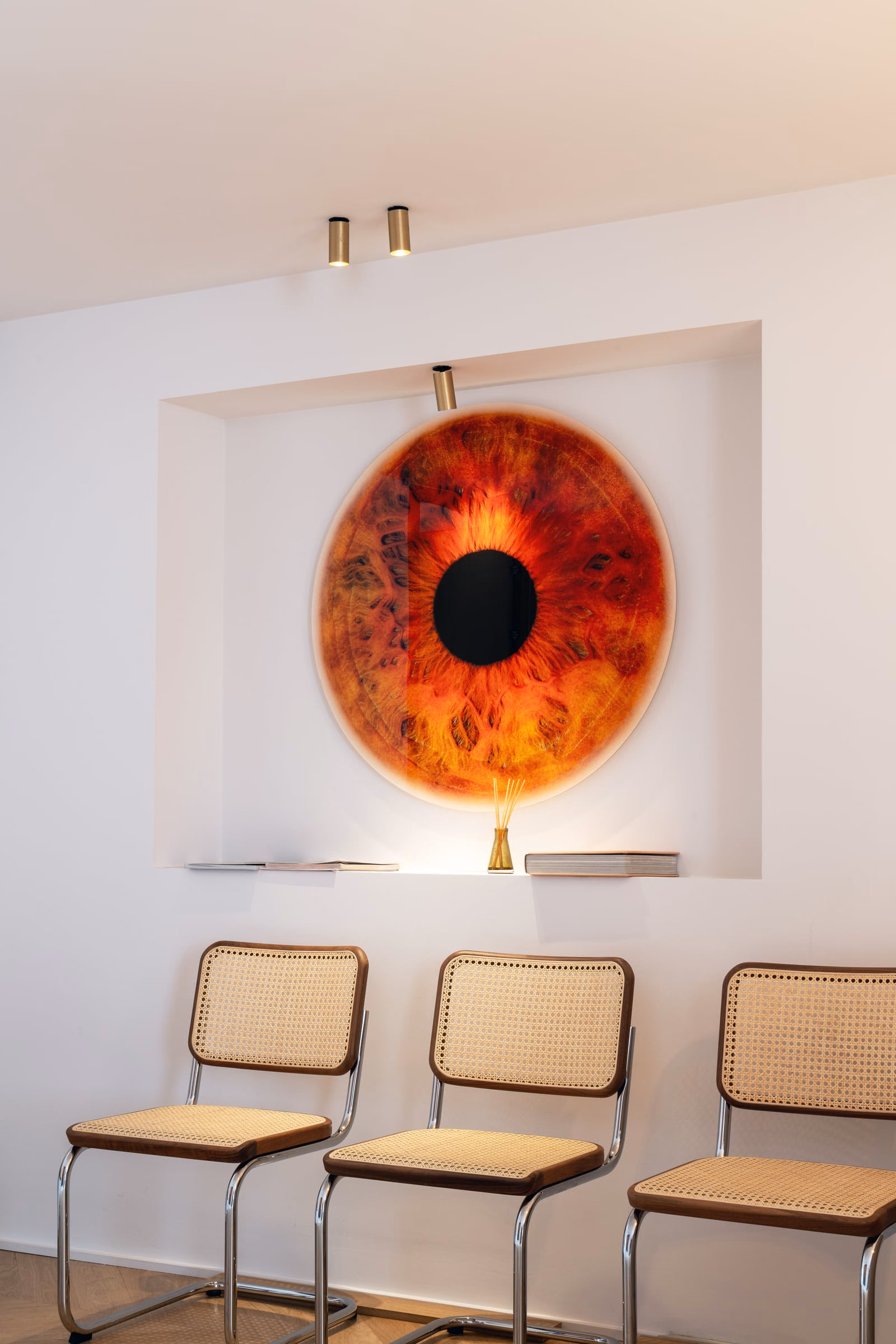 A painting of an eye on a white wall