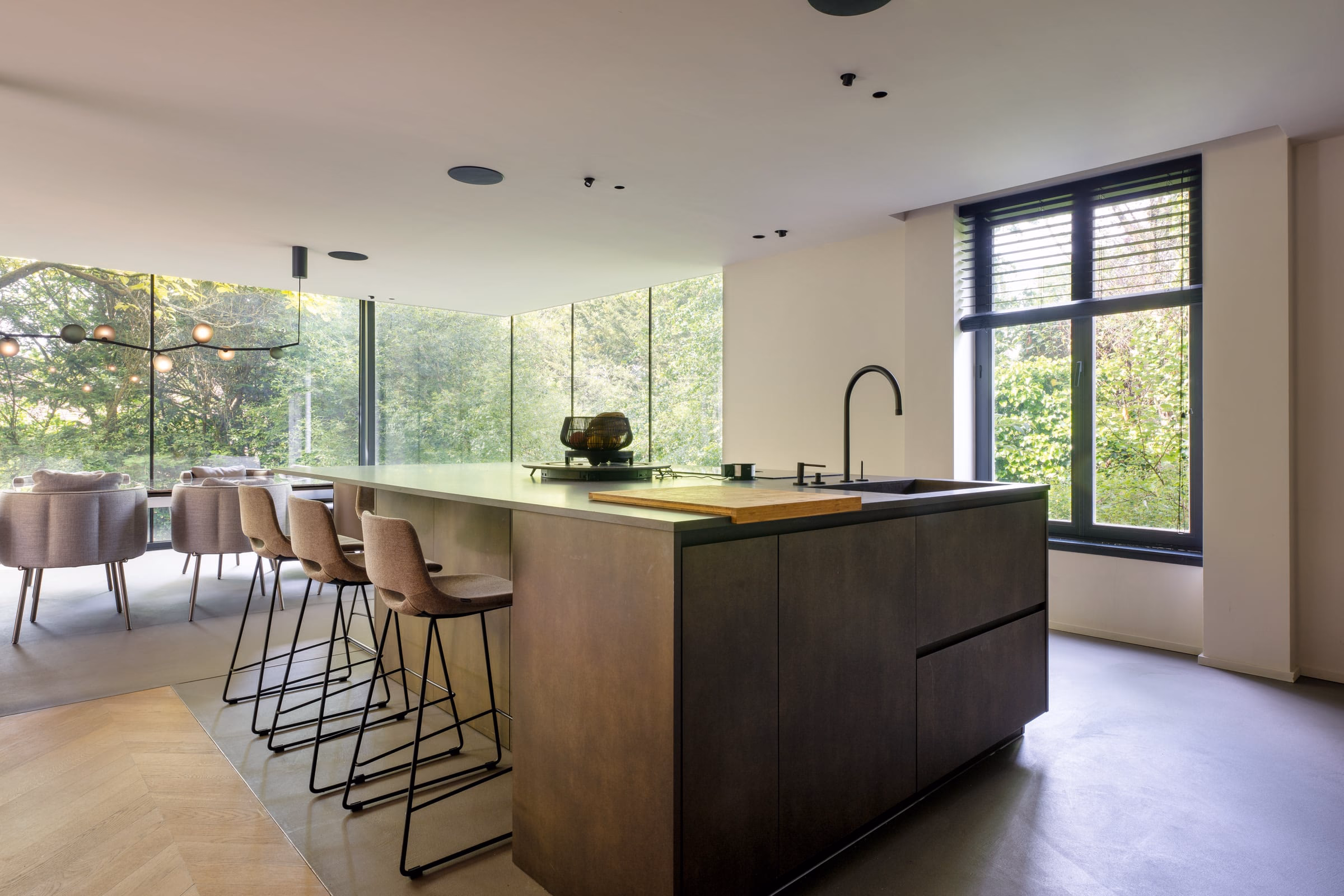 A kitchen with a large island and stools