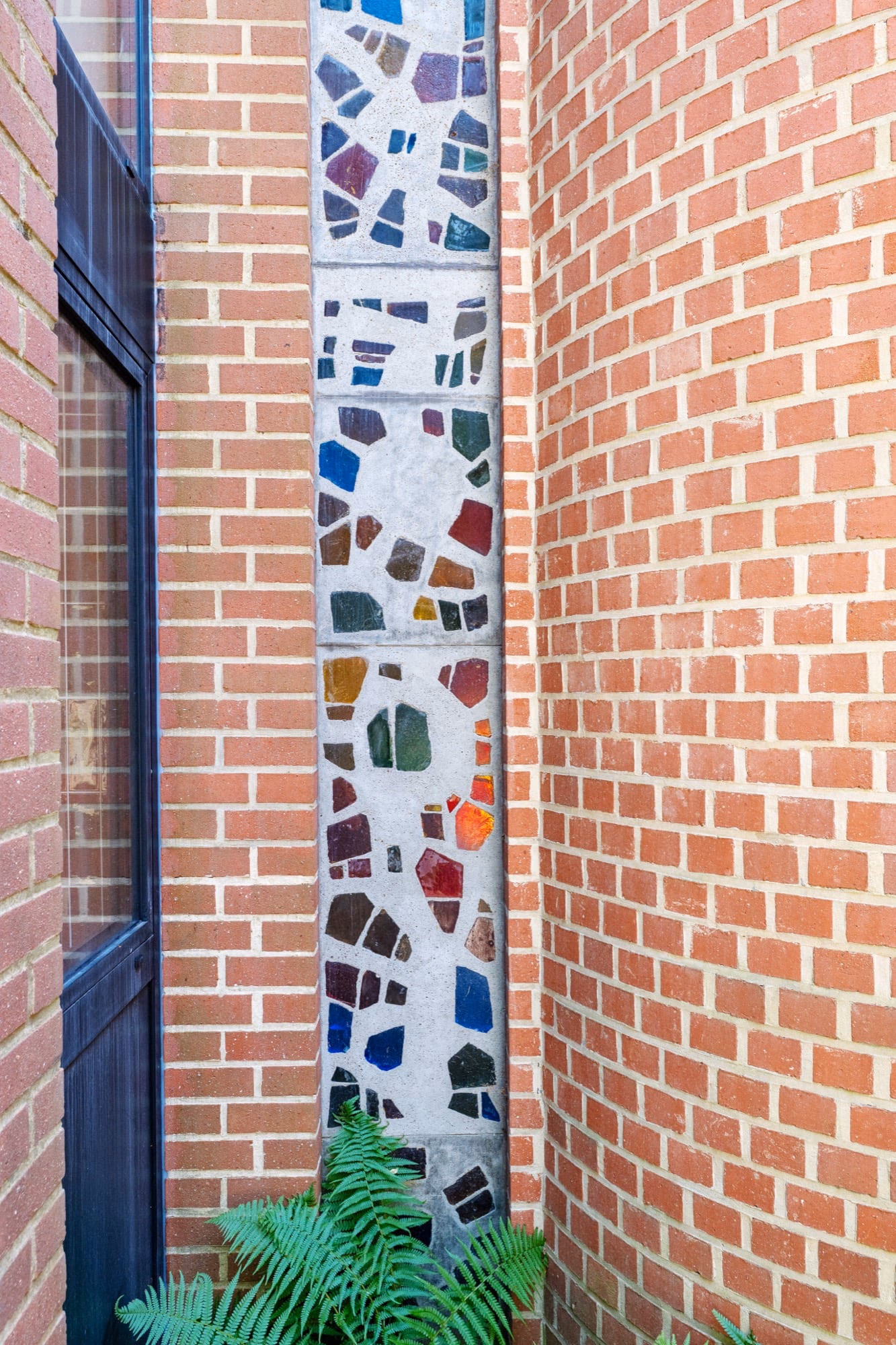 A brick wall with a stained-glass design