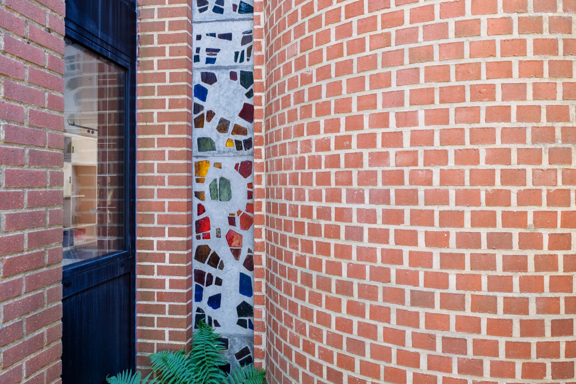 A brick wall with a stained-glass design